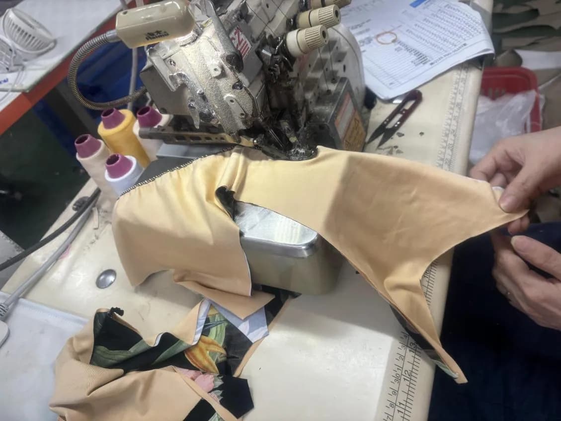 Pre-production swimwear sample sewn on the production line