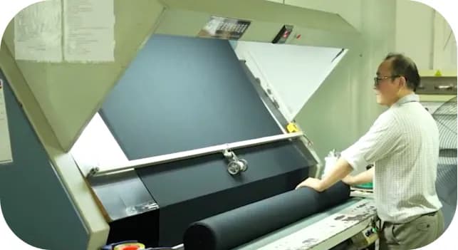 Fabric inspection machine checking swimwear fabric